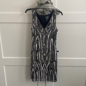 Sequin and beaded fitted V neck party dress.